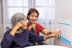Older Woman Reading a Reading Calendar