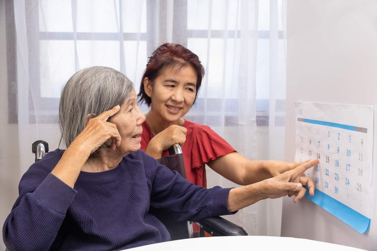 Older Woman Reading a Reading Calendar