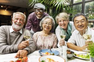 seniors enjoy dinner together