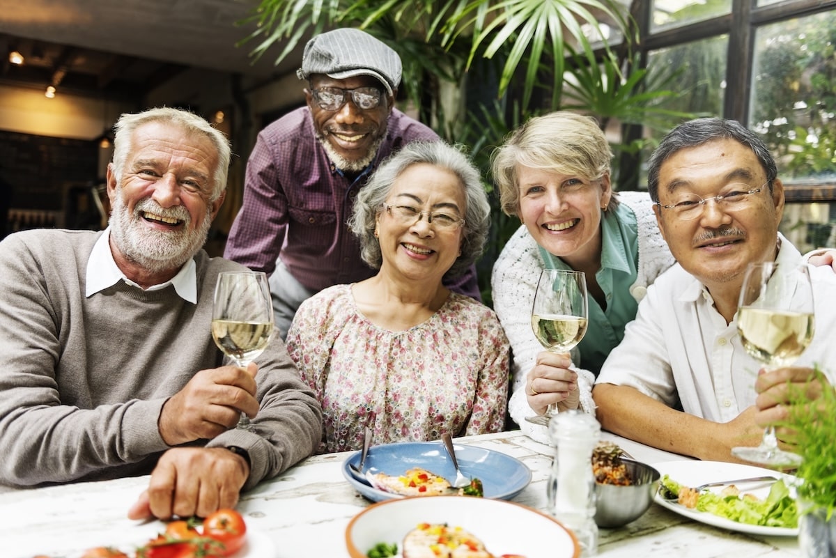 seniors enjoy dinner together