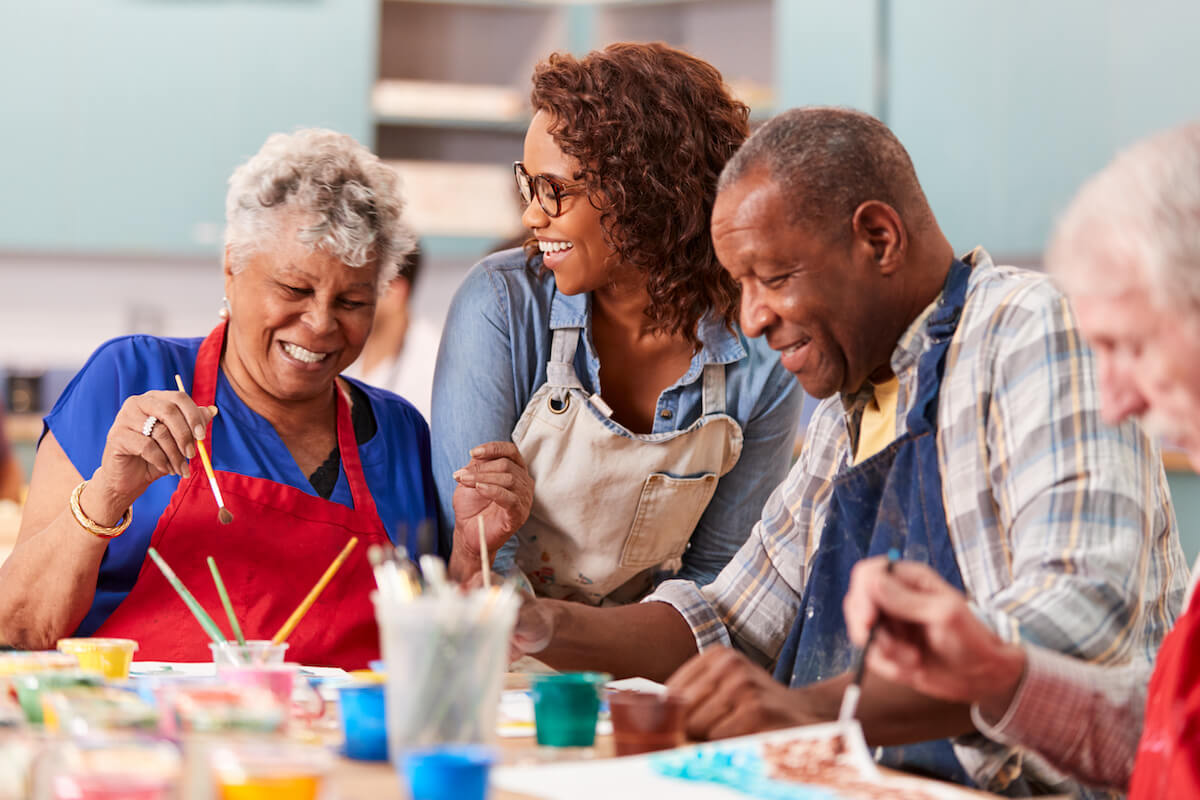 Group of joyful seniors in a creative workshop